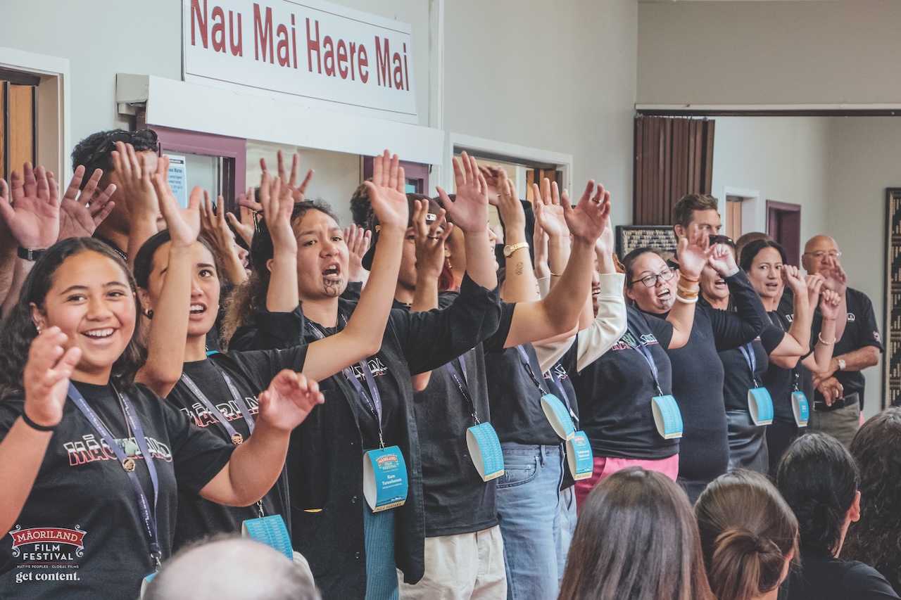 Picture of the Māoriland team singing at the MFF2023 Powhiri